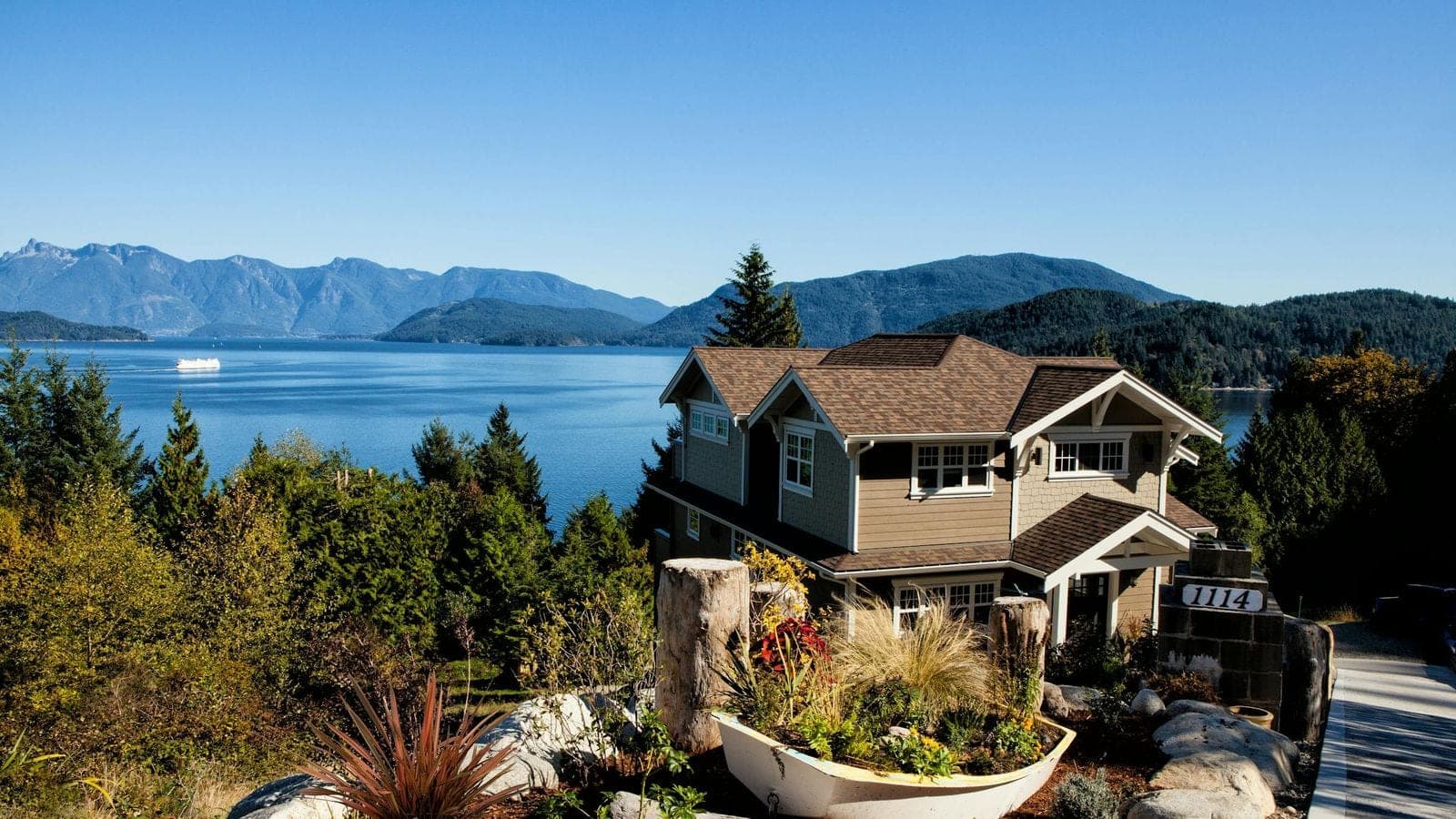 A West Coast home overlooking Howe Sound and the Coast Mountains — illustrative of the Greater Vancouver homes that come through BC court-ordered sales.